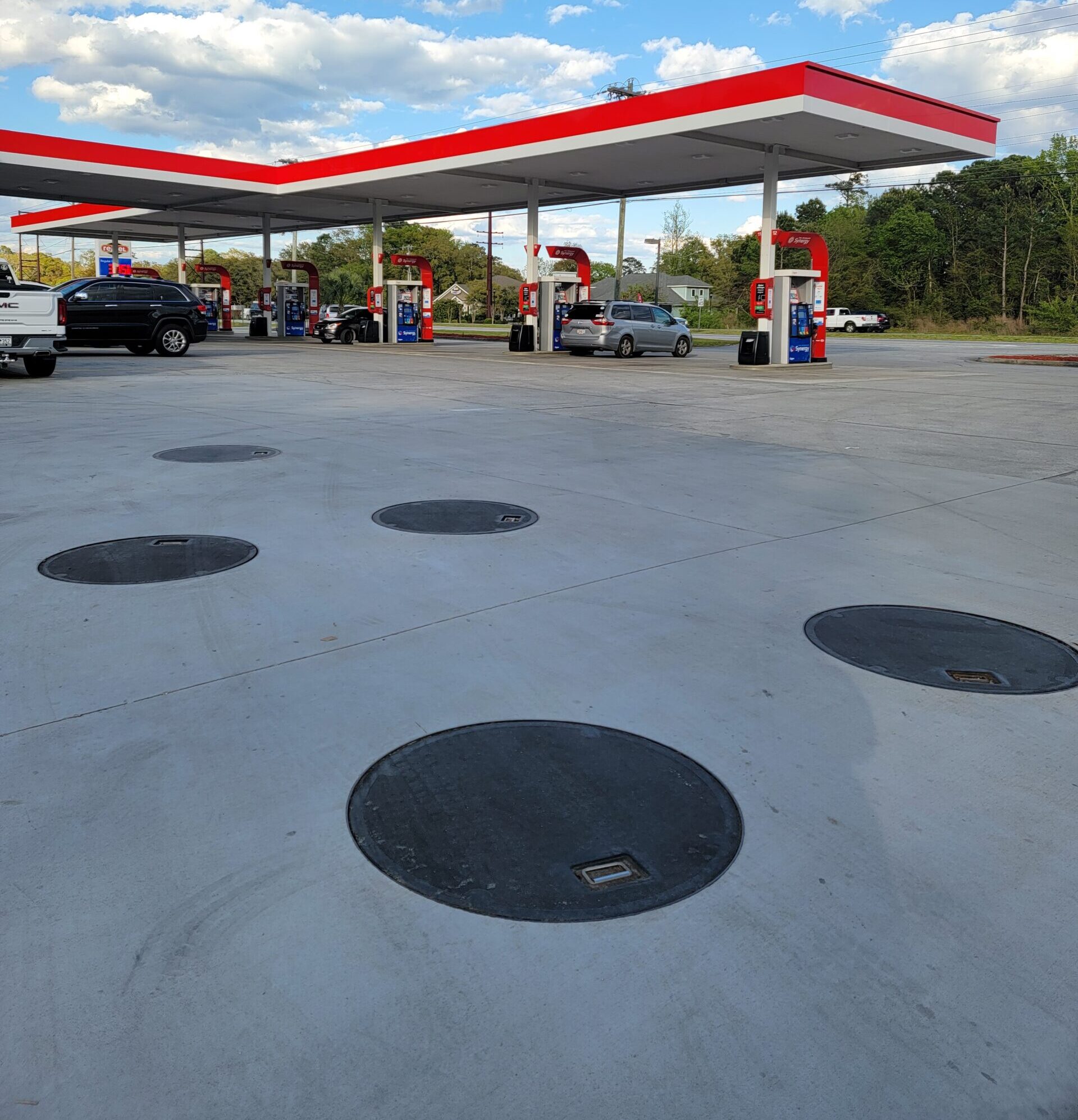 COMPOSITE ROUND COVERS INSTALLED AT GAS STATION