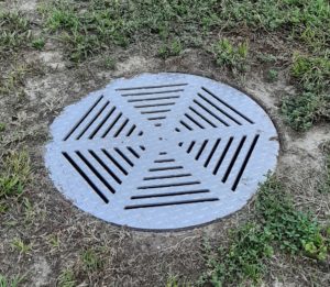 LD DRAIN COVER INSTALLED GRASS SURROUND