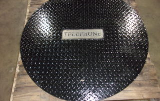 Manhole Cover with "telephone" I.D. Tag