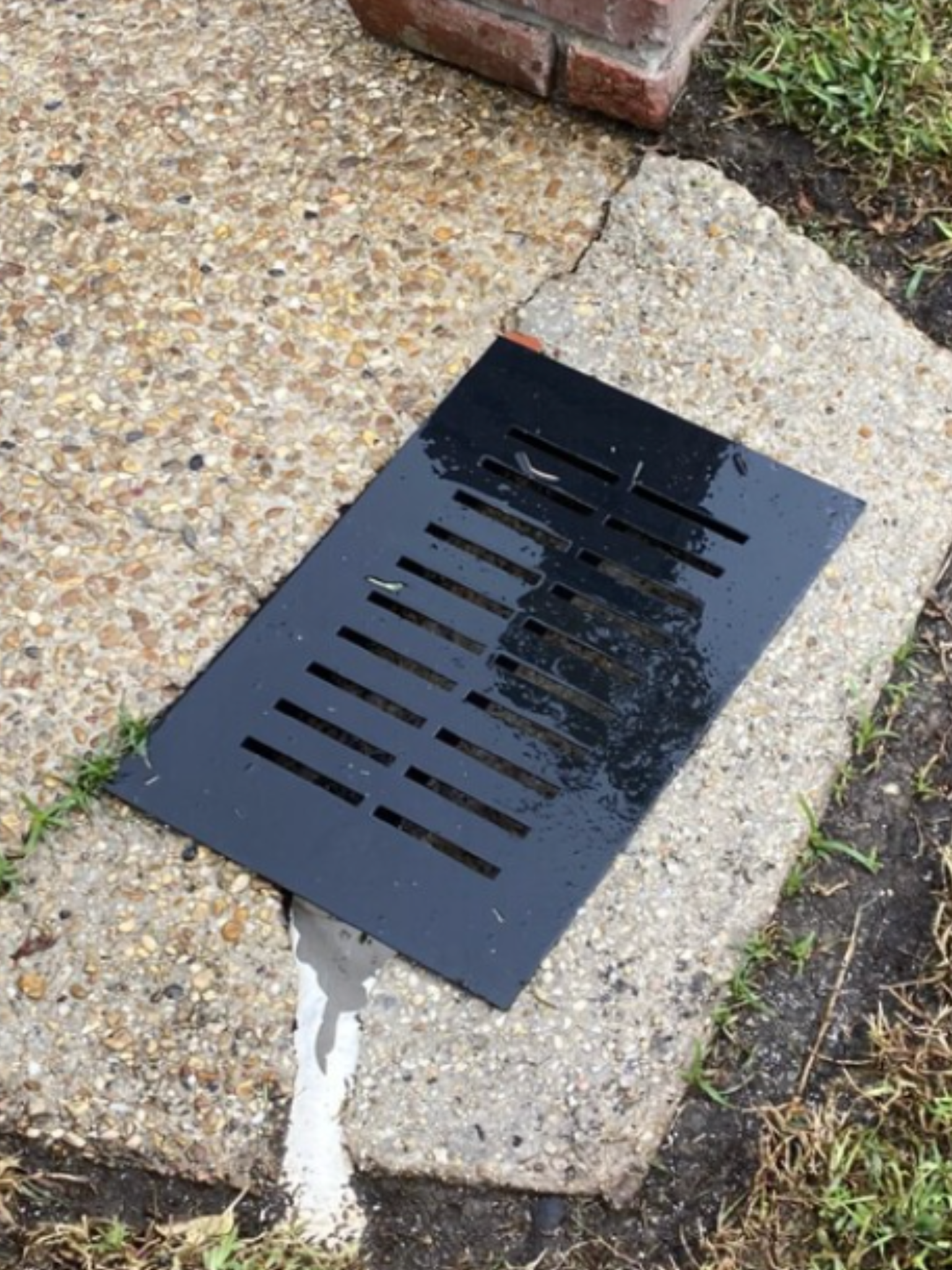 wet black drain grate