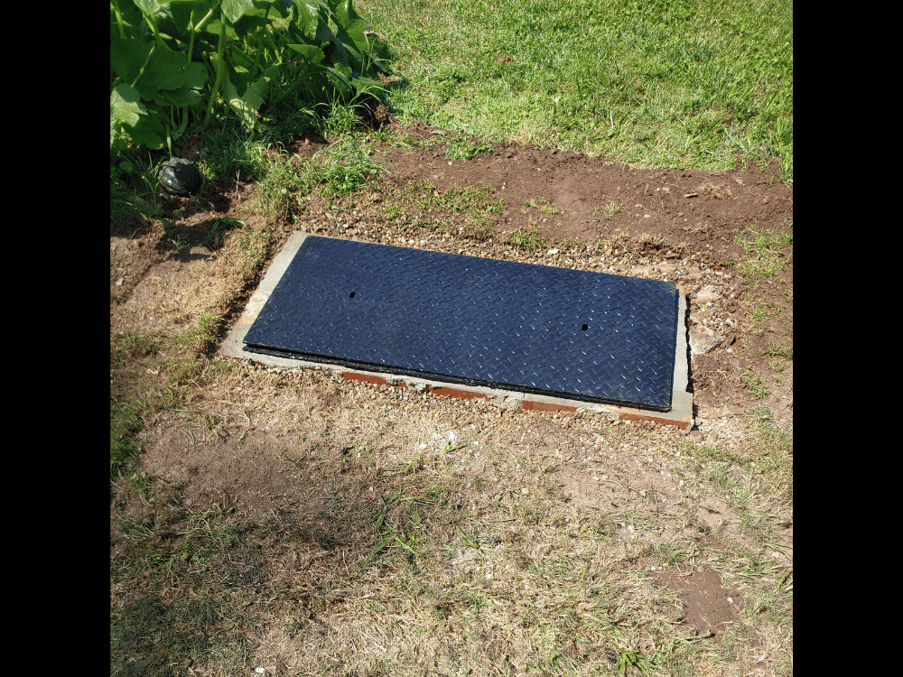 Water well covered with new manhole cover