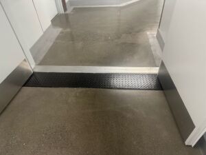 trench-drain-grate-covers-hotel-hallway