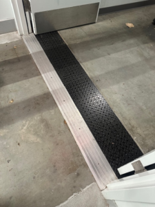 trench-drain-grate-covers-hotel-hallway